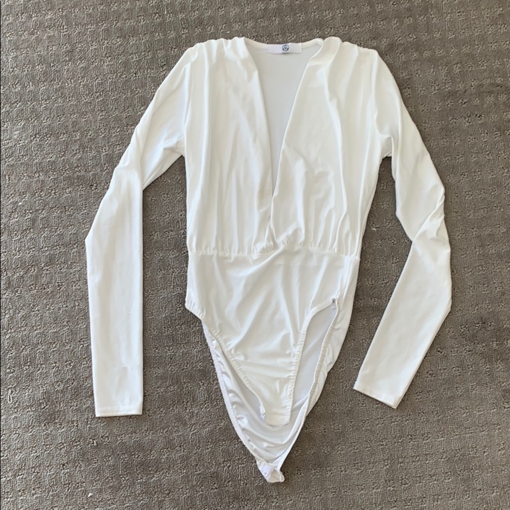 Deep V cut white long sleeved bodysuit